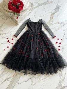 Elegant Black Gown with Red Roses