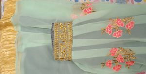 light blue colour fully stitched skirt with golden border in bottom and and work in flair .
