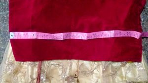 The maroon  lehenga   with golden colour net gown