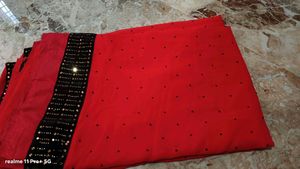Elegant Red Saree with Black Embellished Border