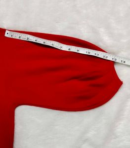 red woolen top