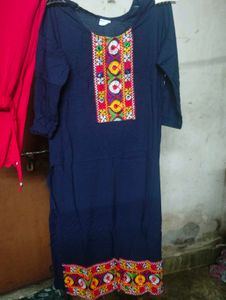 Navy Blue Embroidered Kurta with red pants.