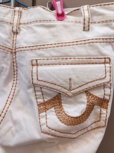 Stylish White Jeans with Brown Stitching