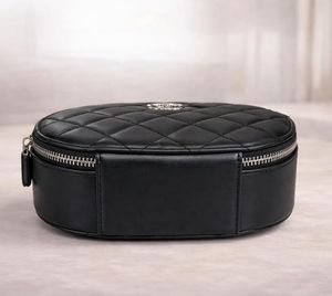 Black Quilted Oval Crossbody Bag