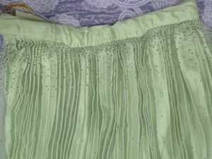 green lehenga with embellishments