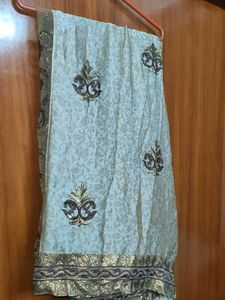 Khaki Embroidered and sequin silk net Saree