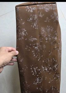 Cute shoulder bag with self color floral print.
