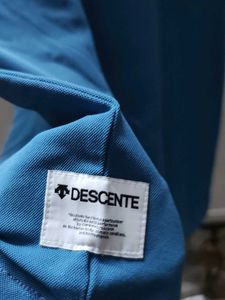 descente pastel blue polo t shirt