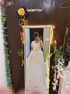 white full length gown with too much detailing