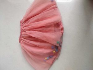 Net pink skirt with pumpum and flower