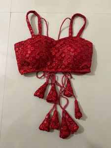 red backless blouse