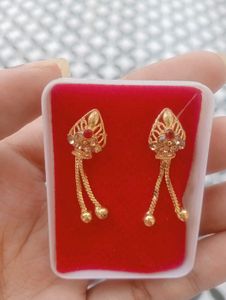 Elegant Gold Tone Earrings with Red Stones