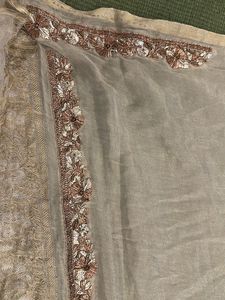 designer blouse piece in soft gold with hand work