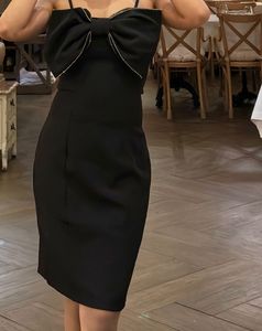 Chic Black Mini Dress with Bow Detail