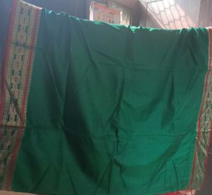 Elegant Green Saree with Red Border