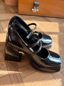 Black Patent Platform Mary Janes heel .