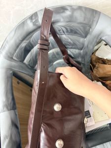 Chic Brown Leather Shoulder Bag with Silver Studs