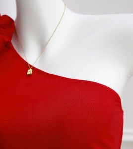 Chic Red One-Shoulder Top with Flower Accent