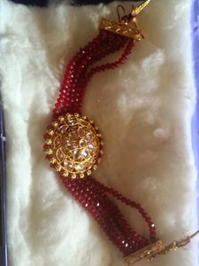 Red Beaded Bracelet with Gold Tone Accent