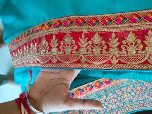 Elegant Teal Saree with Embroidered Border