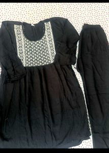 Elegant Black Kurta Set with Embellished Neckline