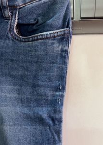 Distressed Blue Denim Jeans