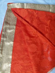 Vibrant Orange Saree with Golden Border
