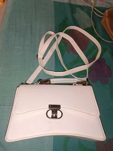 chic white sling and handbag