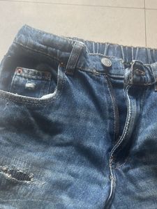 Distressed Blue Denim Jeans