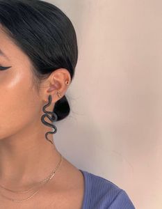 Handmade unequal pair of snake earrings