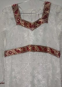 Elegant White Lace Gown with Red Trim