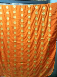 Vibrant Orange Saree with Gold Dots
