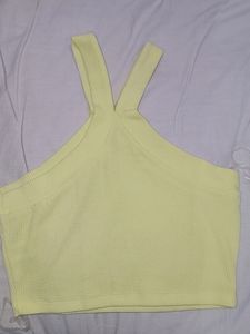 A yellow crop off-shoulder top