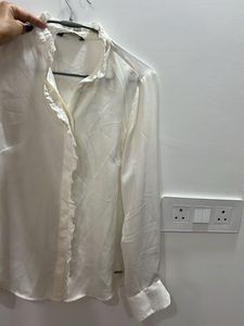 Elegant Cream Top with Metal Detail