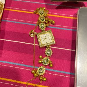 Elegant Gold Watch with Intricate Embellishments