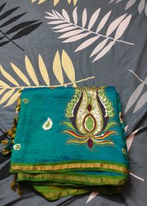 Elegant Teal Saree with Embellished Detailing