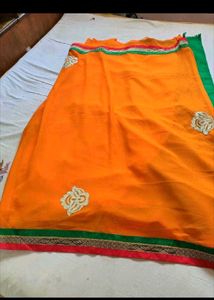 Vibrant Orange Saree with Golden Border