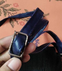 Chic Black Crossbody Bag with Pom Po