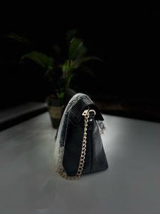 Leather Sling Bag.
