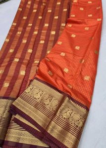 Elegant Orange Saree with Peacock Border