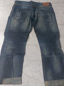 Distressed Blue Denim Jeans