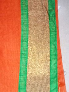 Vibrant Orange Saree with Embellished Blouse