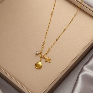 Gold Charm Necklace with Starfish and Shell