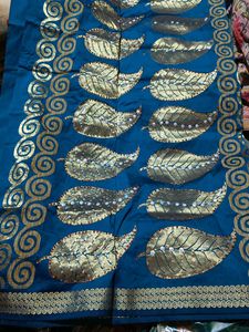 Elegant Teal Saree with Golden Leaf Motifs