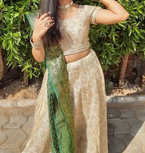 Cream Colour Lehenga Choli With Green Dupatta