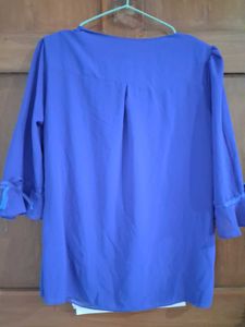 Charming Blue Pleated Blouse with Floral Accents