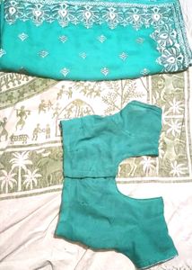 Elegant Teal Saree with Silver Embellishments