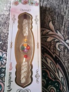 Beautiful Pearl Rakhi with Floral Pendant