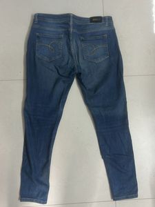 Distressed Blue Denim Jeans