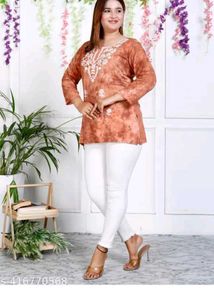Embroidered Orange Kurti with White Pants